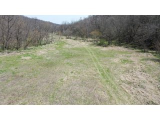 This 32+/- acre piece of timber sits in the middle of an area known for quality whitetail deer hunting. With both south and north facing hillsides spanning the property and a flat, open creek bottom, there are numerous locations for box blinds with great visibility. There are well defined deer trails throughout the property along with UTV access. The 4.97+/- acres of CRP that lays in the bottom of the valley provide income while at the same time creating wildlife habitat. This is also the perfect spot for future food plots. An easement through the farm off of Kittoe Lane gains access to this newly sectioned parcel. - REAL ESTATE FOR SALE - 32+/- ACRES - GRANT COUNTY, WI