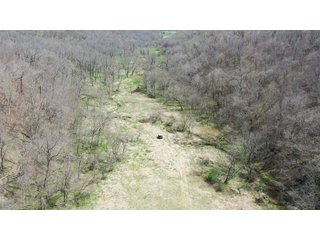 This 32+/- acre piece of timber sits in the middle of an area known for quality whitetail deer hunting. With both south and north facing hillsides spanning the property and a flat, open creek bottom, there are numerous locations for box blinds with great visibility. There are well defined deer trails throughout the property along with UTV access. The 4.97+/- acres of CRP that lays in the bottom of the valley provide income while at the same time creating wildlife habitat. This is also the perfect spot for future food plots. An easement through the farm off of Kittoe Lane gains access to this newly sectioned parcel. - REAL ESTATE FOR SALE - 32+/- ACRES - GRANT COUNTY, WI
