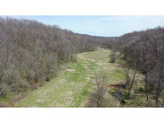 This 32+/- acre piece of timber sits in the middle of an area known for quality whitetail deer hunting. With both south and north facing hillsides spanning the property and a flat, open creek bottom, there are numerous locations for box blinds with great visibility. There are well defined deer trails throughout the property along with UTV access. The 4.97+/- acres of CRP that lays in the bottom of the valley provide income while at the same time creating wildlife habitat. This is also the perfect spot for future food plots. An easement through the farm off of Kittoe Lane gains access to this newly sectioned parcel. - REAL ESTATE FOR SALE - 32+/- ACRES - GRANT COUNTY, WI