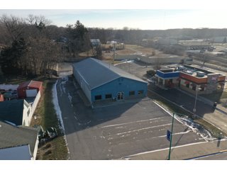 <b><font size=5 color=red>**PRICE REDUCED AGAIN!**</font></b><br><br>Now that the owners have moved to a new location this building is for sale and is a unique opportunity to purchase a large building and commercial lot in a great location right of SR 9 and within Albion. The lot is .710 acres and the property contains a 5,712 sq. ft. building that includes two large workshops as well as two office spaces and a restroom. The perimeter fence was installed around the back end of the lot in 2017. The building boasts excellent internet and phone service with Ligtel Fiber Optics installed in 2019. All new gutters and ice jams were installed in 2020. There is a 7.5 Horsepower air compressor with 3/4 Rapid Air lines on the east end of the building. The building contains dual furnaces, with the west half of the building being heated and cooled and east end being heat only. The building has been managed tremendously and has a wide variety of possible uses! Don't miss out on this unique chance to acquire a nice building with a great location!<li>Great frontage and visibility being located right off SR 9
<li>Hi Efficiency LED Lights Installed in 2020
<li>Extremely well-maintained building
<li>Ligtel Fiber Optics Installed in 2019
<li>Can be creative with uses, very adaptable building!<br>
<li>Water is with Albion City Utilities with an average cost of $30 per month
<li>Utilities NIPSCO (GAS) monthly fees $175 winter $50 summer (Approx)
<li>Electric AEP with costs ranging from $225 - 300 (Approx)
<li>Taxes $3,306.40 per year
<li>$10,000 available from the Town of Albion for front facade upgrading
<li>Possible entrance from back onto S. Liberty St. by applying for a driveway permit
<li>11 1/2ft ceilings
<li>10ft x 12ft overhead door in rear
<li>2- offices and 1 bathroom - REAL ESTATE FOR SALE - COMMERCIAL BUILDING - NOBLE COUNTY, IN **PRICE REDUCED**