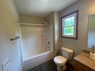 The former Sherman home is laid out for very comfortable living with an open style floor plan. The main living area contains numerous windows allowing for great natural light, and great visibility to the backyard of flowers and many varieties of trees such as Pear, Plum, and Cherry. The home also contains a gas fireplace with 3 bedrooms, 2 full baths, sun porch, garden shed, and a 733 sq. ft. 3 car garage. The home has central air and heat, a gas range, and a hot water heater. The refrigerator, washer, and dryer go with the home.  The septic has been pumped every 2 years, and the property has a 4in. well. All doors are wheelchair accessible and there is additional attic storage above the garage.  - RANCH STYLE HOME FOR SALE