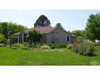 The former Sherman home is laid out for very comfortable living with an open style floor plan. The main living area contains numerous windows allowing for great natural light, and great visibility to the backyard of flowers and many varieties of trees such as Pear, Plum, and Cherry. The home also contains a gas fireplace with 3 bedrooms, 2 full baths, sun porch, garden shed, and a 733 sq. ft. 3 car garage. The home has central air and heat, a gas range, and a hot water heater. The refrigerator, washer, and dryer go with the home.  The septic has been pumped every 2 years, and the property has a 4in. well. All doors are wheelchair accessible and there is additional attic storage above the garage.  - RANCH STYLE HOME FOR SALE