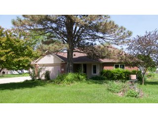 The former Sherman home is laid out for very comfortable living with an open style floor plan. The main living area contains numerous windows allowing for great natural light, and great visibility to the backyard of flowers and many varieties of trees such as Pear, Plum, and Cherry. The home also contains a gas fireplace with 3 bedrooms, 2 full baths, sun porch, garden shed, and a 733 sq. ft. 3 car garage. The home has central air and heat, a gas range, and a hot water heater. The refrigerator, washer, and dryer go with the home.  The septic has been pumped every 2 years, and the property has a 4in. well. All doors are wheelchair accessible and there is additional attic storage above the garage.  - RANCH STYLE HOME FOR SALE
