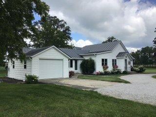 Don't miss this opportunity to experience country living at it's finest! This is a 3-bedroom, 2-bath, 1,876 square foot Country Home that has been completely updated and is ready to enjoy. The updates include a new addition, new roof, siding, wood flooring, air conditioner, heating system, electrical - you name it and it has been updated. Enjoy the beautiful landscaping and wide-open spaces that include mature trees, new plantings and even an apple orchard. House features include a 15x17 family room, 11x15 formal dining room, large bedrooms, parlor, sun room, large deck, laundry room, basement, whole-house generator and more. Outdoors you will find a spacious barn with room for tools, lawn equipment and even animals. There is also approximately 4 1/2 +/- acres for added income potential. This is a wonderful opportunity to create your dream home in the country. Up to 68+/- additional acres available with full frontage on the Mississinewa River. - BEAUTIFUL COUNTRY HOME FOR SALE - 13+/- ACRES IN DELAWARE COUNTY, INDIANA