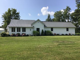 Don't miss this opportunity to experience country living at it's finest! This is a 3-bedroom, 2-bath, 1,876 square foot Country Home that has been completely updated and is ready to enjoy. The updates include a new addition, new roof, siding, wood flooring, air conditioner, heating system, electrical - you name it and it has been updated. Enjoy the beautiful landscaping and wide-open spaces that include mature trees, new plantings and even an apple orchard. House features include a 15x17 family room, 11x15 formal dining room, large bedrooms, parlor, sun room, large deck, laundry room, basement, whole-house generator and more. Outdoors you will find a spacious barn with room for tools, lawn equipment and even animals. There is also approximately 4 1/2 +/- acres for added income potential. This is a wonderful opportunity to create your dream home in the country. Up to 68+/- additional acres available with full frontage on the Mississinewa River. - BEAUTIFUL COUNTRY HOME FOR SALE - 13+/- ACRES IN DELAWARE COUNTY, INDIANA