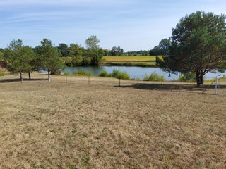 Beautiful country home. 2,692+/- finished sq. ft. home or a total of  3,588+/- sq. ft., 2 pole buildings 40'x75' & 50'x50' w/ interconnecting corridor, both heated & insulated. One has been used as a shop/storage/commercially & has water & rest room. The other has multi-uses w/ tile flooring, full bath & kitchenette great for get-togethers, auto storage & many other uses & a 32'x40' pole building w/ gravel floor great for horses & livestock or extra storage, an additional separate 2 car garage. The home has had many updates most noticeably a totally remodeled master suite, flooring throughout the home, a second main floor bedroom w/ walkout deck & patio, there is a 3rd bedroom, upstairs & large landing w/ room for an extra bed. One & a half baths, large living room, sliding door to deck & patio. Eat in kitchen w/ appliances, a separate dining area. Central air & heat pump. Shady rear patio & deck. The basement is partially finished. There are many updates & amenities too numerous to mention & must be seen in person. A great property for storage, business, hobbies and/or livestock. Stocked fish pond, pasture & potential building site. Come & investigate the potential. - REAL ESTATE FOR SALE - 10.2+/- ACRES IN WHITLEY COUNTY INDIANA
