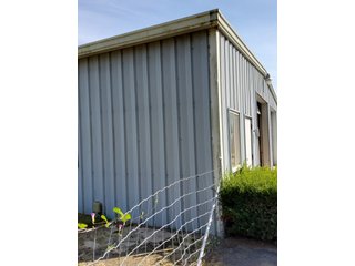 Beautiful country home. 2,692+/- finished sq. ft. home or a total of  3,588+/- sq. ft., 2 pole buildings 40'x75' & 50'x50' w/ interconnecting corridor, both heated & insulated. One has been used as a shop/storage/commercially & has water & rest room. The other has multi-uses w/ tile flooring, full bath & kitchenette great for get-togethers, auto storage & many other uses & a 32'x40' pole building w/ gravel floor great for horses & livestock or extra storage, an additional separate 2 car garage. The home has had many updates most noticeably a totally remodeled master suite, flooring throughout the home, a second main floor bedroom w/ walkout deck & patio, there is a 3rd bedroom, upstairs & large landing w/ room for an extra bed. One & a half baths, large living room, sliding door to deck & patio. Eat in kitchen w/ appliances, a separate dining area. Central air & heat pump. Shady rear patio & deck. The basement is partially finished. There are many updates & amenities too numerous to mention & must be seen in person. A great property for storage, business, hobbies and/or livestock. Stocked fish pond, pasture & potential building site. Come & investigate the potential. - REAL ESTATE FOR SALE - 10.2+/- ACRES IN WHITLEY COUNTY INDIANA