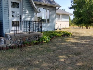 Beautiful country home. 2,692+/- finished sq. ft. home or a total of  3,588+/- sq. ft., 2 pole buildings 40'x75' & 50'x50' w/ interconnecting corridor, both heated & insulated. One has been used as a shop/storage/commercially & has water & rest room. The other has multi-uses w/ tile flooring, full bath & kitchenette great for get-togethers, auto storage & many other uses & a 32'x40' pole building w/ gravel floor great for horses & livestock or extra storage, an additional separate 2 car garage. The home has had many updates most noticeably a totally remodeled master suite, flooring throughout the home, a second main floor bedroom w/ walkout deck & patio, there is a 3rd bedroom, upstairs & large landing w/ room for an extra bed. One & a half baths, large living room, sliding door to deck & patio. Eat in kitchen w/ appliances, a separate dining area. Central air & heat pump. Shady rear patio & deck. The basement is partially finished. There are many updates & amenities too numerous to mention & must be seen in person. A great property for storage, business, hobbies and/or livestock. Stocked fish pond, pasture & potential building site. Come & investigate the potential. - REAL ESTATE FOR SALE - 10.2+/- ACRES IN WHITLEY COUNTY INDIANA