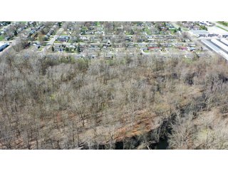Consider the potential of this 18.77+/- acre woods within Warsaw city limits. Hunting available with permit. Potential timber value. Close to Little League baseball diamonds. - 18.77+/- Acres for Sale in Kosciusko County, Indiana