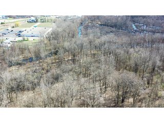 Consider the potential of this 18.77+/- acre woods within Warsaw city limits. Hunting available with permit. Potential timber value. Close to Little League baseball diamonds. - 18.77+/- Acres for Sale in Kosciusko County, Indiana