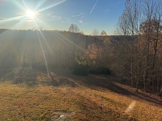 This 153+/- acre piece located in Mammoth Cave, KY sits in Edmonson County and borders the famous Mammoth Cave National Park. Any avid outdoorsman will quickly grow to admire this rural masterpiece and the natural beauty it provides. The property features numerous ponds, abundant wooded area suitable for hunting, and more. The primary dwelling measures 1,840 square feet and consists of three bedrooms, two bathrooms, and an unfinished basement. The dwelling also contains a 640 square foot two car attached garage. Additionally, a small hunting type cabin is present on the property as well as a utility barn for storage or other purposes. Furthermore, the property is within close proximity to a wide variety of attractions, such as Mammoth Cave, Nolin Lake, Blue Holler Off-Road Park, Mammoth Cave Horse Camp and much more. A wonderful opportunity for anyone looking for their ideal outdoor escape! - A Beautiful Setting in the Hills of South Central Kentucky!!