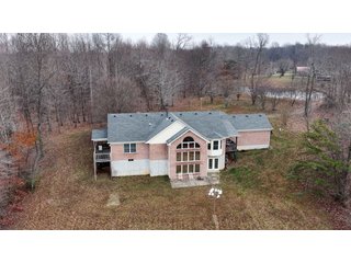 This 153+/- acre piece located in Mammoth Cave, KY sits in Edmonson County and borders the famous Mammoth Cave National Park. Any avid outdoorsman will quickly grow to admire this rural masterpiece and the natural beauty it provides. The property features numerous ponds, abundant wooded area suitable for hunting, and more. The primary dwelling measures 1,840 square feet and consists of three bedrooms, two bathrooms, and an unfinished basement. The dwelling also contains a 640 square foot two car attached garage. Additionally, a small hunting type cabin is present on the property as well as a utility barn for storage or other purposes. Furthermore, the property is within close proximity to a wide variety of attractions, such as Mammoth Cave, Nolin Lake, Blue Holler Off-Road Park, Mammoth Cave Horse Camp and much more. A wonderful opportunity for anyone looking for their ideal outdoor escape! - A Beautiful Setting in the Hills of South Central Kentucky!!