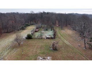 This 153+/- acre piece located in Mammoth Cave, KY sits in Edmonson County and borders the famous Mammoth Cave National Park. Any avid outdoorsman will quickly grow to admire this rural masterpiece and the natural beauty it provides. The property features numerous ponds, abundant wooded area suitable for hunting, and more. The primary dwelling measures 1,840 square feet and consists of three bedrooms, two bathrooms, and an unfinished basement. The dwelling also contains a 640 square foot two car attached garage. Additionally, a small hunting type cabin is present on the property as well as a utility barn for storage or other purposes. Furthermore, the property is within close proximity to a wide variety of attractions, such as Mammoth Cave, Nolin Lake, Blue Holler Off-Road Park, Mammoth Cave Horse Camp and much more. A wonderful opportunity for anyone looking for their ideal outdoor escape! - A Beautiful Setting in the Hills of South Central Kentucky!!