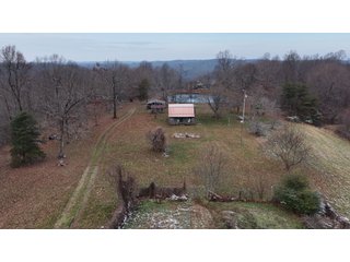 This 153+/- acre piece located in Mammoth Cave, KY sits in Edmonson County and borders the famous Mammoth Cave National Park. Any avid outdoorsman will quickly grow to admire this rural masterpiece and the natural beauty it provides. The property features numerous ponds, abundant wooded area suitable for hunting, and more. The primary dwelling measures 1,840 square feet and consists of three bedrooms, two bathrooms, and an unfinished basement. The dwelling also contains a 640 square foot two car attached garage. Additionally, a small hunting type cabin is present on the property as well as a utility barn for storage or other purposes. Furthermore, the property is within close proximity to a wide variety of attractions, such as Mammoth Cave, Nolin Lake, Blue Holler Off-Road Park, Mammoth Cave Horse Camp and much more. A wonderful opportunity for anyone looking for their ideal outdoor escape! - A Beautiful Setting in the Hills of South Central Kentucky!!