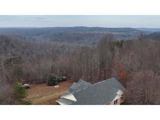 This 153+/- acre piece located in Mammoth Cave, KY sits in Edmonson County and borders the famous Mammoth Cave National Park. Any avid outdoorsman will quickly grow to admire this rural masterpiece and the natural beauty it provides. The property features numerous ponds, abundant wooded area suitable for hunting, and more. The primary dwelling measures 1,840 square feet and consists of three bedrooms, two bathrooms, and an unfinished basement. The dwelling also contains a 640 square foot two car attached garage. Additionally, a small hunting type cabin is present on the property as well as a utility barn for storage or other purposes. Furthermore, the property is within close proximity to a wide variety of attractions, such as Mammoth Cave, Nolin Lake, Blue Holler Off-Road Park, Mammoth Cave Horse Camp and much more. A wonderful opportunity for anyone looking for their ideal outdoor escape! - A Beautiful Setting in the Hills of South Central Kentucky!!