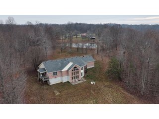 This 153+/- acre piece located in Mammoth Cave, KY sits in Edmonson County and borders the famous Mammoth Cave National Park. Any avid outdoorsman will quickly grow to admire this rural masterpiece and the natural beauty it provides. The property features numerous ponds, abundant wooded area suitable for hunting, and more. The primary dwelling measures 1,840 square feet and consists of three bedrooms, two bathrooms, and an unfinished basement. The dwelling also contains a 640 square foot two car attached garage. Additionally, a small hunting type cabin is present on the property as well as a utility barn for storage or other purposes. Furthermore, the property is within close proximity to a wide variety of attractions, such as Mammoth Cave, Nolin Lake, Blue Holler Off-Road Park, Mammoth Cave Horse Camp and much more. A wonderful opportunity for anyone looking for their ideal outdoor escape! - A Beautiful Setting in the Hills of South Central Kentucky!!