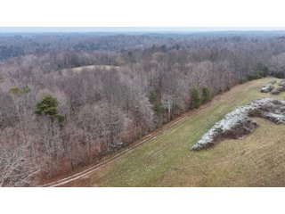 This 153+/- acre piece located in Mammoth Cave, KY sits in Edmonson County and borders the famous Mammoth Cave National Park. Any avid outdoorsman will quickly grow to admire this rural masterpiece and the natural beauty it provides. The property features numerous ponds, abundant wooded area suitable for hunting, and more. The primary dwelling measures 1,840 square feet and consists of three bedrooms, two bathrooms, and an unfinished basement. The dwelling also contains a 640 square foot two car attached garage. Additionally, a small hunting type cabin is present on the property as well as a utility barn for storage or other purposes. Furthermore, the property is within close proximity to a wide variety of attractions, such as Mammoth Cave, Nolin Lake, Blue Holler Off-Road Park, Mammoth Cave Horse Camp and much more. A wonderful opportunity for anyone looking for their ideal outdoor escape! - A Beautiful Setting in the Hills of South Central Kentucky!!
