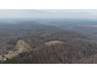 This 153+/- acre piece located in Mammoth Cave, KY sits in Edmonson County and borders the famous Mammoth Cave National Park. Any avid outdoorsman will quickly grow to admire this rural masterpiece and the natural beauty it provides. The property features numerous ponds, abundant wooded area suitable for hunting, and more. The primary dwelling measures 1,840 square feet and consists of three bedrooms, two bathrooms, and an unfinished basement. The dwelling also contains a 640 square foot two car attached garage. Additionally, a small hunting type cabin is present on the property as well as a utility barn for storage or other purposes. Furthermore, the property is within close proximity to a wide variety of attractions, such as Mammoth Cave, Nolin Lake, Blue Holler Off-Road Park, Mammoth Cave Horse Camp and much more. A wonderful opportunity for anyone looking for their ideal outdoor escape! - A Beautiful Setting in the Hills of South Central Kentucky!!