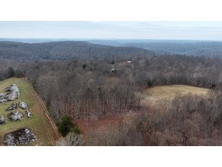 This 153+/- acre piece located in Mammoth Cave, KY sits in Edmonson County and borders the famous Mammoth Cave National Park. Any avid outdoorsman will quickly grow to admire this rural masterpiece and the natural beauty it provides. The property features numerous ponds, abundant wooded area suitable for hunting, and more. The primary dwelling measures 1,840 square feet and consists of three bedrooms, two bathrooms, and an unfinished basement. The dwelling also contains a 640 square foot two car attached garage. Additionally, a small hunting type cabin is present on the property as well as a utility barn for storage or other purposes. Furthermore, the property is within close proximity to a wide variety of attractions, such as Mammoth Cave, Nolin Lake, Blue Holler Off-Road Park, Mammoth Cave Horse Camp and much more. A wonderful opportunity for anyone looking for their ideal outdoor escape! - A Beautiful Setting in the Hills of South Central Kentucky!!