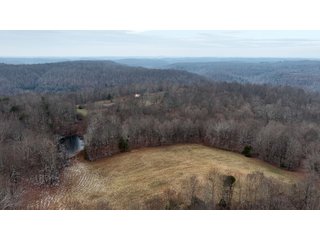 This 153+/- acre piece located in Mammoth Cave, KY sits in Edmonson County and borders the famous Mammoth Cave National Park. Any avid outdoorsman will quickly grow to admire this rural masterpiece and the natural beauty it provides. The property features numerous ponds, abundant wooded area suitable for hunting, and more. The primary dwelling measures 1,840 square feet and consists of three bedrooms, two bathrooms, and an unfinished basement. The dwelling also contains a 640 square foot two car attached garage. Additionally, a small hunting type cabin is present on the property as well as a utility barn for storage or other purposes. Furthermore, the property is within close proximity to a wide variety of attractions, such as Mammoth Cave, Nolin Lake, Blue Holler Off-Road Park, Mammoth Cave Horse Camp and much more. A wonderful opportunity for anyone looking for their ideal outdoor escape! - A Beautiful Setting in the Hills of South Central Kentucky!!