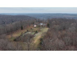 This 153+/- acre piece located in Mammoth Cave, KY sits in Edmonson County and borders the famous Mammoth Cave National Park. Any avid outdoorsman will quickly grow to admire this rural masterpiece and the natural beauty it provides. The property features numerous ponds, abundant wooded area suitable for hunting, and more. The primary dwelling measures 1,840 square feet and consists of three bedrooms, two bathrooms, and an unfinished basement. The dwelling also contains a 640 square foot two car attached garage. Additionally, a small hunting type cabin is present on the property as well as a utility barn for storage or other purposes. Furthermore, the property is within close proximity to a wide variety of attractions, such as Mammoth Cave, Nolin Lake, Blue Holler Off-Road Park, Mammoth Cave Horse Camp and much more. A wonderful opportunity for anyone looking for their ideal outdoor escape! - A Beautiful Setting in the Hills of South Central Kentucky!!