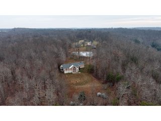 This 153+/- acre piece located in Mammoth Cave, KY sits in Edmonson County and borders the famous Mammoth Cave National Park. Any avid outdoorsman will quickly grow to admire this rural masterpiece and the natural beauty it provides. The property features numerous ponds, abundant wooded area suitable for hunting, and more. The primary dwelling measures 1,840 square feet and consists of three bedrooms, two bathrooms, and an unfinished basement. The dwelling also contains a 640 square foot two car attached garage. Additionally, a small hunting type cabin is present on the property as well as a utility barn for storage or other purposes. Furthermore, the property is within close proximity to a wide variety of attractions, such as Mammoth Cave, Nolin Lake, Blue Holler Off-Road Park, Mammoth Cave Horse Camp and much more. A wonderful opportunity for anyone looking for their ideal outdoor escape! - A Beautiful Setting in the Hills of South Central Kentucky!!