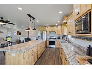 <B><font color=red>STILL ACCEPTING OFFERS</FONT></B>


Schrader Real Estate & Auction Co is pleased to present this unique real estate opportunity comprised of a beautiful custom-built home, scenic pond, large machine shed and barn, all sitting on 34+/- acres. Enjoy your morning coffee from the spacious kitchen or covered deck while seeing wildlife in the fields and pond. This setting offers both the enjoyment of relaxing by yourself or hosting large gatherings with friends and family in the finished basement or large outdoor patio with over 1,000 sq ft of outdoor finished space. Get ready to enjoy all the benefits of being in the country with both the machine shed that has a heated office or in the barn set up for your choice of any type of livestock. With the barn having concrete floor and fully insulated, this can easily be converted to a shop or storage. <br>
<li>	Built in 2021
<li>	Oversized 3-Car Garage
<li>	Custom made Cabinets and Vanities
<li>	Stainless steel appliances
<li>	Gas and Electric hookup for Stove and Dryer
<li>	Gas hookup for Living Room Fireplace
<li>	Sky lights in Master and Main bathroom
<li>	Finished Heated garage with floor drain and heavy duty wiring and receptacles 
<li>	Freestanding wood/coal Stove in living room (No electric needed)
<li>	Covered front porch, covered deck, and outdoor patio (partially covered)
<li>	Fruit/Root Cellar with Ample Shelving
<li>	Dual zone Upstairs/Downstairs energy efficient LP furnace
<li>	Whole house generator Hookup with Interlock System
<li>	R-24 sidewall/R-60 Ceiling dense pack insulation in House & Garage
<li>	Basement Spray Foamed (Walls and Box Sills)
<li>	All open windows are casement
<li>	Beautiful knotty pine ceilings on both Covered Deck and Porch
<li>	Maintenance-Free siding and decking
<li>	Cement Front porch and sidewalk to patio
<li>	Hookups for big screen in living room, Master bedroom, and Basement
<li>	120 ft drilled well 15 GPM that serves house, barn, shed, and garden
<li>	All underground wiring
<li>	Frost-free hydrant next to fertile mound garden
<li>	Small apple and pear orchard 
<li>	Landscape included trees and perennials for low maintenance 
<li>	Over 300 trees and shrubs in spacious yard 
<li>	Over 150 trees and shrubs under dripline
<li>	Approximately 0.75-acre pond 16 feet deep on far end with rock spillway
<li>	Entire driveway covered with blue rock
<li>	Frostless faucets on three sides of house
<li>	Outside receptacles on all four sides of house (eight total)
<li>	Small porch off laundry room with maintenance free decking
<li>	Battery backup sump pump that very rarely turns on
<li>	All high tensile woven wire fencing with six separated pasture and paddocks - REAL ESTATE FOR SALE 34+/- ACRES IN MARATHON COUNTY, WISCONSIN