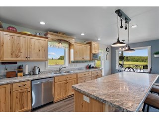 <B><font color=red>STILL ACCEPTING OFFERS</FONT></B>


Schrader Real Estate & Auction Co is pleased to present this unique real estate opportunity comprised of a beautiful custom-built home, scenic pond, large machine shed and barn, all sitting on 34+/- acres. Enjoy your morning coffee from the spacious kitchen or covered deck while seeing wildlife in the fields and pond. This setting offers both the enjoyment of relaxing by yourself or hosting large gatherings with friends and family in the finished basement or large outdoor patio with over 1,000 sq ft of outdoor finished space. Get ready to enjoy all the benefits of being in the country with both the machine shed that has a heated office or in the barn set up for your choice of any type of livestock. With the barn having concrete floor and fully insulated, this can easily be converted to a shop or storage. <br>
<li>	Built in 2021
<li>	Oversized 3-Car Garage
<li>	Custom made Cabinets and Vanities
<li>	Stainless steel appliances
<li>	Gas and Electric hookup for Stove and Dryer
<li>	Gas hookup for Living Room Fireplace
<li>	Sky lights in Master and Main bathroom
<li>	Finished Heated garage with floor drain and heavy duty wiring and receptacles 
<li>	Freestanding wood/coal Stove in living room (No electric needed)
<li>	Covered front porch, covered deck, and outdoor patio (partially covered)
<li>	Fruit/Root Cellar with Ample Shelving
<li>	Dual zone Upstairs/Downstairs energy efficient LP furnace
<li>	Whole house generator Hookup with Interlock System
<li>	R-24 sidewall/R-60 Ceiling dense pack insulation in House & Garage
<li>	Basement Spray Foamed (Walls and Box Sills)
<li>	All open windows are casement
<li>	Beautiful knotty pine ceilings on both Covered Deck and Porch
<li>	Maintenance-Free siding and decking
<li>	Cement Front porch and sidewalk to patio
<li>	Hookups for big screen in living room, Master bedroom, and Basement
<li>	120 ft drilled well 15 GPM that serves house, barn, shed, and garden
<li>	All underground wiring
<li>	Frost-free hydrant next to fertile mound garden
<li>	Small apple and pear orchard 
<li>	Landscape included trees and perennials for low maintenance 
<li>	Over 300 trees and shrubs in spacious yard 
<li>	Over 150 trees and shrubs under dripline
<li>	Approximately 0.75-acre pond 16 feet deep on far end with rock spillway
<li>	Entire driveway covered with blue rock
<li>	Frostless faucets on three sides of house
<li>	Outside receptacles on all four sides of house (eight total)
<li>	Small porch off laundry room with maintenance free decking
<li>	Battery backup sump pump that very rarely turns on
<li>	All high tensile woven wire fencing with six separated pasture and paddocks - REAL ESTATE FOR SALE 34+/- ACRES IN MARATHON COUNTY, WISCONSIN