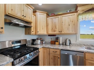 <B><font color=red>STILL ACCEPTING OFFERS</FONT></B>


Schrader Real Estate & Auction Co is pleased to present this unique real estate opportunity comprised of a beautiful custom-built home, scenic pond, large machine shed and barn, all sitting on 34+/- acres. Enjoy your morning coffee from the spacious kitchen or covered deck while seeing wildlife in the fields and pond. This setting offers both the enjoyment of relaxing by yourself or hosting large gatherings with friends and family in the finished basement or large outdoor patio with over 1,000 sq ft of outdoor finished space. Get ready to enjoy all the benefits of being in the country with both the machine shed that has a heated office or in the barn set up for your choice of any type of livestock. With the barn having concrete floor and fully insulated, this can easily be converted to a shop or storage. <br>
<li>	Built in 2021
<li>	Oversized 3-Car Garage
<li>	Custom made Cabinets and Vanities
<li>	Stainless steel appliances
<li>	Gas and Electric hookup for Stove and Dryer
<li>	Gas hookup for Living Room Fireplace
<li>	Sky lights in Master and Main bathroom
<li>	Finished Heated garage with floor drain and heavy duty wiring and receptacles 
<li>	Freestanding wood/coal Stove in living room (No electric needed)
<li>	Covered front porch, covered deck, and outdoor patio (partially covered)
<li>	Fruit/Root Cellar with Ample Shelving
<li>	Dual zone Upstairs/Downstairs energy efficient LP furnace
<li>	Whole house generator Hookup with Interlock System
<li>	R-24 sidewall/R-60 Ceiling dense pack insulation in House & Garage
<li>	Basement Spray Foamed (Walls and Box Sills)
<li>	All open windows are casement
<li>	Beautiful knotty pine ceilings on both Covered Deck and Porch
<li>	Maintenance-Free siding and decking
<li>	Cement Front porch and sidewalk to patio
<li>	Hookups for big screen in living room, Master bedroom, and Basement
<li>	120 ft drilled well 15 GPM that serves house, barn, shed, and garden
<li>	All underground wiring
<li>	Frost-free hydrant next to fertile mound garden
<li>	Small apple and pear orchard 
<li>	Landscape included trees and perennials for low maintenance 
<li>	Over 300 trees and shrubs in spacious yard 
<li>	Over 150 trees and shrubs under dripline
<li>	Approximately 0.75-acre pond 16 feet deep on far end with rock spillway
<li>	Entire driveway covered with blue rock
<li>	Frostless faucets on three sides of house
<li>	Outside receptacles on all four sides of house (eight total)
<li>	Small porch off laundry room with maintenance free decking
<li>	Battery backup sump pump that very rarely turns on
<li>	All high tensile woven wire fencing with six separated pasture and paddocks - REAL ESTATE FOR SALE 34+/- ACRES IN MARATHON COUNTY, WISCONSIN