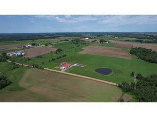 <B><font color=red>STILL ACCEPTING OFFERS</FONT></B>


Schrader Real Estate & Auction Co is pleased to present this unique real estate opportunity comprised of a beautiful custom-built home, scenic pond, large machine shed and barn, all sitting on 34+/- acres. Enjoy your morning coffee from the spacious kitchen or covered deck while seeing wildlife in the fields and pond. This setting offers both the enjoyment of relaxing by yourself or hosting large gatherings with friends and family in the finished basement or large outdoor patio with over 1,000 sq ft of outdoor finished space. Get ready to enjoy all the benefits of being in the country with both the machine shed that has a heated office or in the barn set up for your choice of any type of livestock. With the barn having concrete floor and fully insulated, this can easily be converted to a shop or storage. <br>
<li>	Built in 2021
<li>	Oversized 3-Car Garage
<li>	Custom made Cabinets and Vanities
<li>	Stainless steel appliances
<li>	Gas and Electric hookup for Stove and Dryer
<li>	Gas hookup for Living Room Fireplace
<li>	Sky lights in Master and Main bathroom
<li>	Finished Heated garage with floor drain and heavy duty wiring and receptacles 
<li>	Freestanding wood/coal Stove in living room (No electric needed)
<li>	Covered front porch, covered deck, and outdoor patio (partially covered)
<li>	Fruit/Root Cellar with Ample Shelving
<li>	Dual zone Upstairs/Downstairs energy efficient LP furnace
<li>	Whole house generator Hookup with Interlock System
<li>	R-24 sidewall/R-60 Ceiling dense pack insulation in House & Garage
<li>	Basement Spray Foamed (Walls and Box Sills)
<li>	All open windows are casement
<li>	Beautiful knotty pine ceilings on both Covered Deck and Porch
<li>	Maintenance-Free siding and decking
<li>	Cement Front porch and sidewalk to patio
<li>	Hookups for big screen in living room, Master bedroom, and Basement
<li>	120 ft drilled well 15 GPM that serves house, barn, shed, and garden
<li>	All underground wiring
<li>	Frost-free hydrant next to fertile mound garden
<li>	Small apple and pear orchard 
<li>	Landscape included trees and perennials for low maintenance 
<li>	Over 300 trees and shrubs in spacious yard 
<li>	Over 150 trees and shrubs under dripline
<li>	Approximately 0.75-acre pond 16 feet deep on far end with rock spillway
<li>	Entire driveway covered with blue rock
<li>	Frostless faucets on three sides of house
<li>	Outside receptacles on all four sides of house (eight total)
<li>	Small porch off laundry room with maintenance free decking
<li>	Battery backup sump pump that very rarely turns on
<li>	All high tensile woven wire fencing with six separated pasture and paddocks - REAL ESTATE FOR SALE 34+/- ACRES IN MARATHON COUNTY, WISCONSIN