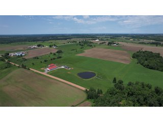 <B><font color=red>STILL ACCEPTING OFFERS</FONT></B>


Schrader Real Estate & Auction Co is pleased to present this unique real estate opportunity comprised of a beautiful custom-built home, scenic pond, large machine shed and barn, all sitting on 34+/- acres. Enjoy your morning coffee from the spacious kitchen or covered deck while seeing wildlife in the fields and pond. This setting offers both the enjoyment of relaxing by yourself or hosting large gatherings with friends and family in the finished basement or large outdoor patio with over 1,000 sq ft of outdoor finished space. Get ready to enjoy all the benefits of being in the country with both the machine shed that has a heated office or in the barn set up for your choice of any type of livestock. With the barn having concrete floor and fully insulated, this can easily be converted to a shop or storage. <br>
<li>	Built in 2021
<li>	Oversized 3-Car Garage
<li>	Custom made Cabinets and Vanities
<li>	Stainless steel appliances
<li>	Gas and Electric hookup for Stove and Dryer
<li>	Gas hookup for Living Room Fireplace
<li>	Sky lights in Master and Main bathroom
<li>	Finished Heated garage with floor drain and heavy duty wiring and receptacles 
<li>	Freestanding wood/coal Stove in living room (No electric needed)
<li>	Covered front porch, covered deck, and outdoor patio (partially covered)
<li>	Fruit/Root Cellar with Ample Shelving
<li>	Dual zone Upstairs/Downstairs energy efficient LP furnace
<li>	Whole house generator Hookup with Interlock System
<li>	R-24 sidewall/R-60 Ceiling dense pack insulation in House & Garage
<li>	Basement Spray Foamed (Walls and Box Sills)
<li>	All open windows are casement
<li>	Beautiful knotty pine ceilings on both Covered Deck and Porch
<li>	Maintenance-Free siding and decking
<li>	Cement Front porch and sidewalk to patio
<li>	Hookups for big screen in living room, Master bedroom, and Basement
<li>	120 ft drilled well 15 GPM that serves house, barn, shed, and garden
<li>	All underground wiring
<li>	Frost-free hydrant next to fertile mound garden
<li>	Small apple and pear orchard 
<li>	Landscape included trees and perennials for low maintenance 
<li>	Over 300 trees and shrubs in spacious yard 
<li>	Over 150 trees and shrubs under dripline
<li>	Approximately 0.75-acre pond 16 feet deep on far end with rock spillway
<li>	Entire driveway covered with blue rock
<li>	Frostless faucets on three sides of house
<li>	Outside receptacles on all four sides of house (eight total)
<li>	Small porch off laundry room with maintenance free decking
<li>	Battery backup sump pump that very rarely turns on
<li>	All high tensile woven wire fencing with six separated pasture and paddocks - REAL ESTATE FOR SALE 34+/- ACRES IN MARATHON COUNTY, WISCONSIN