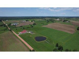 <B><font color=red>STILL ACCEPTING OFFERS</FONT></B>


Schrader Real Estate & Auction Co is pleased to present this unique real estate opportunity comprised of a beautiful custom-built home, scenic pond, large machine shed and barn, all sitting on 34+/- acres. Enjoy your morning coffee from the spacious kitchen or covered deck while seeing wildlife in the fields and pond. This setting offers both the enjoyment of relaxing by yourself or hosting large gatherings with friends and family in the finished basement or large outdoor patio with over 1,000 sq ft of outdoor finished space. Get ready to enjoy all the benefits of being in the country with both the machine shed that has a heated office or in the barn set up for your choice of any type of livestock. With the barn having concrete floor and fully insulated, this can easily be converted to a shop or storage. <br>
<li>	Built in 2021
<li>	Oversized 3-Car Garage
<li>	Custom made Cabinets and Vanities
<li>	Stainless steel appliances
<li>	Gas and Electric hookup for Stove and Dryer
<li>	Gas hookup for Living Room Fireplace
<li>	Sky lights in Master and Main bathroom
<li>	Finished Heated garage with floor drain and heavy duty wiring and receptacles 
<li>	Freestanding wood/coal Stove in living room (No electric needed)
<li>	Covered front porch, covered deck, and outdoor patio (partially covered)
<li>	Fruit/Root Cellar with Ample Shelving
<li>	Dual zone Upstairs/Downstairs energy efficient LP furnace
<li>	Whole house generator Hookup with Interlock System
<li>	R-24 sidewall/R-60 Ceiling dense pack insulation in House & Garage
<li>	Basement Spray Foamed (Walls and Box Sills)
<li>	All open windows are casement
<li>	Beautiful knotty pine ceilings on both Covered Deck and Porch
<li>	Maintenance-Free siding and decking
<li>	Cement Front porch and sidewalk to patio
<li>	Hookups for big screen in living room, Master bedroom, and Basement
<li>	120 ft drilled well 15 GPM that serves house, barn, shed, and garden
<li>	All underground wiring
<li>	Frost-free hydrant next to fertile mound garden
<li>	Small apple and pear orchard 
<li>	Landscape included trees and perennials for low maintenance 
<li>	Over 300 trees and shrubs in spacious yard 
<li>	Over 150 trees and shrubs under dripline
<li>	Approximately 0.75-acre pond 16 feet deep on far end with rock spillway
<li>	Entire driveway covered with blue rock
<li>	Frostless faucets on three sides of house
<li>	Outside receptacles on all four sides of house (eight total)
<li>	Small porch off laundry room with maintenance free decking
<li>	Battery backup sump pump that very rarely turns on
<li>	All high tensile woven wire fencing with six separated pasture and paddocks - REAL ESTATE FOR SALE 34+/- ACRES IN MARATHON COUNTY, WISCONSIN