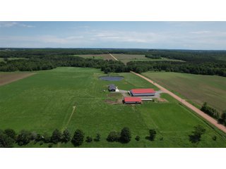 <B><font color=red>STILL ACCEPTING OFFERS</FONT></B>


Schrader Real Estate & Auction Co is pleased to present this unique real estate opportunity comprised of a beautiful custom-built home, scenic pond, large machine shed and barn, all sitting on 34+/- acres. Enjoy your morning coffee from the spacious kitchen or covered deck while seeing wildlife in the fields and pond. This setting offers both the enjoyment of relaxing by yourself or hosting large gatherings with friends and family in the finished basement or large outdoor patio with over 1,000 sq ft of outdoor finished space. Get ready to enjoy all the benefits of being in the country with both the machine shed that has a heated office or in the barn set up for your choice of any type of livestock. With the barn having concrete floor and fully insulated, this can easily be converted to a shop or storage. <br>
<li>	Built in 2021
<li>	Oversized 3-Car Garage
<li>	Custom made Cabinets and Vanities
<li>	Stainless steel appliances
<li>	Gas and Electric hookup for Stove and Dryer
<li>	Gas hookup for Living Room Fireplace
<li>	Sky lights in Master and Main bathroom
<li>	Finished Heated garage with floor drain and heavy duty wiring and receptacles 
<li>	Freestanding wood/coal Stove in living room (No electric needed)
<li>	Covered front porch, covered deck, and outdoor patio (partially covered)
<li>	Fruit/Root Cellar with Ample Shelving
<li>	Dual zone Upstairs/Downstairs energy efficient LP furnace
<li>	Whole house generator Hookup with Interlock System
<li>	R-24 sidewall/R-60 Ceiling dense pack insulation in House & Garage
<li>	Basement Spray Foamed (Walls and Box Sills)
<li>	All open windows are casement
<li>	Beautiful knotty pine ceilings on both Covered Deck and Porch
<li>	Maintenance-Free siding and decking
<li>	Cement Front porch and sidewalk to patio
<li>	Hookups for big screen in living room, Master bedroom, and Basement
<li>	120 ft drilled well 15 GPM that serves house, barn, shed, and garden
<li>	All underground wiring
<li>	Frost-free hydrant next to fertile mound garden
<li>	Small apple and pear orchard 
<li>	Landscape included trees and perennials for low maintenance 
<li>	Over 300 trees and shrubs in spacious yard 
<li>	Over 150 trees and shrubs under dripline
<li>	Approximately 0.75-acre pond 16 feet deep on far end with rock spillway
<li>	Entire driveway covered with blue rock
<li>	Frostless faucets on three sides of house
<li>	Outside receptacles on all four sides of house (eight total)
<li>	Small porch off laundry room with maintenance free decking
<li>	Battery backup sump pump that very rarely turns on
<li>	All high tensile woven wire fencing with six separated pasture and paddocks - REAL ESTATE FOR SALE 34+/- ACRES IN MARATHON COUNTY, WISCONSIN