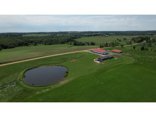 <B><font color=red>STILL ACCEPTING OFFERS</FONT></B>


Schrader Real Estate & Auction Co is pleased to present this unique real estate opportunity comprised of a beautiful custom-built home, scenic pond, large machine shed and barn, all sitting on 34+/- acres. Enjoy your morning coffee from the spacious kitchen or covered deck while seeing wildlife in the fields and pond. This setting offers both the enjoyment of relaxing by yourself or hosting large gatherings with friends and family in the finished basement or large outdoor patio with over 1,000 sq ft of outdoor finished space. Get ready to enjoy all the benefits of being in the country with both the machine shed that has a heated office or in the barn set up for your choice of any type of livestock. With the barn having concrete floor and fully insulated, this can easily be converted to a shop or storage. <br>
<li>	Built in 2021
<li>	Oversized 3-Car Garage
<li>	Custom made Cabinets and Vanities
<li>	Stainless steel appliances
<li>	Gas and Electric hookup for Stove and Dryer
<li>	Gas hookup for Living Room Fireplace
<li>	Sky lights in Master and Main bathroom
<li>	Finished Heated garage with floor drain and heavy duty wiring and receptacles 
<li>	Freestanding wood/coal Stove in living room (No electric needed)
<li>	Covered front porch, covered deck, and outdoor patio (partially covered)
<li>	Fruit/Root Cellar with Ample Shelving
<li>	Dual zone Upstairs/Downstairs energy efficient LP furnace
<li>	Whole house generator Hookup with Interlock System
<li>	R-24 sidewall/R-60 Ceiling dense pack insulation in House & Garage
<li>	Basement Spray Foamed (Walls and Box Sills)
<li>	All open windows are casement
<li>	Beautiful knotty pine ceilings on both Covered Deck and Porch
<li>	Maintenance-Free siding and decking
<li>	Cement Front porch and sidewalk to patio
<li>	Hookups for big screen in living room, Master bedroom, and Basement
<li>	120 ft drilled well 15 GPM that serves house, barn, shed, and garden
<li>	All underground wiring
<li>	Frost-free hydrant next to fertile mound garden
<li>	Small apple and pear orchard 
<li>	Landscape included trees and perennials for low maintenance 
<li>	Over 300 trees and shrubs in spacious yard 
<li>	Over 150 trees and shrubs under dripline
<li>	Approximately 0.75-acre pond 16 feet deep on far end with rock spillway
<li>	Entire driveway covered with blue rock
<li>	Frostless faucets on three sides of house
<li>	Outside receptacles on all four sides of house (eight total)
<li>	Small porch off laundry room with maintenance free decking
<li>	Battery backup sump pump that very rarely turns on
<li>	All high tensile woven wire fencing with six separated pasture and paddocks - REAL ESTATE FOR SALE 34+/- ACRES IN MARATHON COUNTY, WISCONSIN