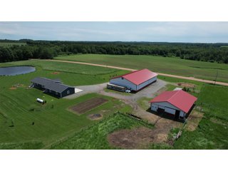 <B><font color=red>STILL ACCEPTING OFFERS</FONT></B>


Schrader Real Estate & Auction Co is pleased to present this unique real estate opportunity comprised of a beautiful custom-built home, scenic pond, large machine shed and barn, all sitting on 34+/- acres. Enjoy your morning coffee from the spacious kitchen or covered deck while seeing wildlife in the fields and pond. This setting offers both the enjoyment of relaxing by yourself or hosting large gatherings with friends and family in the finished basement or large outdoor patio with over 1,000 sq ft of outdoor finished space. Get ready to enjoy all the benefits of being in the country with both the machine shed that has a heated office or in the barn set up for your choice of any type of livestock. With the barn having concrete floor and fully insulated, this can easily be converted to a shop or storage. <br>
<li>	Built in 2021
<li>	Oversized 3-Car Garage
<li>	Custom made Cabinets and Vanities
<li>	Stainless steel appliances
<li>	Gas and Electric hookup for Stove and Dryer
<li>	Gas hookup for Living Room Fireplace
<li>	Sky lights in Master and Main bathroom
<li>	Finished Heated garage with floor drain and heavy duty wiring and receptacles 
<li>	Freestanding wood/coal Stove in living room (No electric needed)
<li>	Covered front porch, covered deck, and outdoor patio (partially covered)
<li>	Fruit/Root Cellar with Ample Shelving
<li>	Dual zone Upstairs/Downstairs energy efficient LP furnace
<li>	Whole house generator Hookup with Interlock System
<li>	R-24 sidewall/R-60 Ceiling dense pack insulation in House & Garage
<li>	Basement Spray Foamed (Walls and Box Sills)
<li>	All open windows are casement
<li>	Beautiful knotty pine ceilings on both Covered Deck and Porch
<li>	Maintenance-Free siding and decking
<li>	Cement Front porch and sidewalk to patio
<li>	Hookups for big screen in living room, Master bedroom, and Basement
<li>	120 ft drilled well 15 GPM that serves house, barn, shed, and garden
<li>	All underground wiring
<li>	Frost-free hydrant next to fertile mound garden
<li>	Small apple and pear orchard 
<li>	Landscape included trees and perennials for low maintenance 
<li>	Over 300 trees and shrubs in spacious yard 
<li>	Over 150 trees and shrubs under dripline
<li>	Approximately 0.75-acre pond 16 feet deep on far end with rock spillway
<li>	Entire driveway covered with blue rock
<li>	Frostless faucets on three sides of house
<li>	Outside receptacles on all four sides of house (eight total)
<li>	Small porch off laundry room with maintenance free decking
<li>	Battery backup sump pump that very rarely turns on
<li>	All high tensile woven wire fencing with six separated pasture and paddocks - REAL ESTATE FOR SALE 34+/- ACRES IN MARATHON COUNTY, WISCONSIN