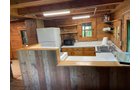 Find yourself surrounded by wooded acres sitting on the covered porch of this secluded log cabin located in central Grant County. There you can enjoy everything nature has to offer from excellent whitetail hunting to watching the variety of birds that frequent the feeders. The log cabin offers all the amenities of modern living including water, septic, electric and LP. The two centrally located food plots along with a spring-fed pond attract deer and other wildlife from the surrounding area. In the spring, enjoy chasing turkey and hunting for morel mushrooms. Take your UTV around the property or down the road just 0.2 miles away to Stitzer Bar & Grill. Perfect for any outdoor enthusiasts!<BR>
-LOG CABIN
-36+/- WOODED ACRES
-FOOD PLOTS
-EXCELLENT WHITETAIL AND TURKEY HUNTING
-POND - REAL ESTATE FOR SALE - 36+/- ACRES IN GRANT COUNTY WISCONSIN