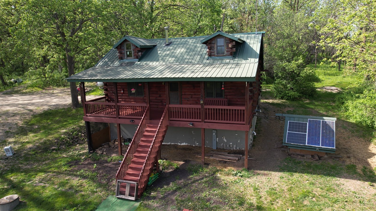 Find yourself surrounded by wooded acres sitting on the covered porch of this secluded log cabin located in central Grant County. There you can enjoy everything nature has to offer from excellent whitetail hunting to watching the variety of birds that frequent the feeders. The log cabin offers all the amenities of modern living including water, septic, electric and LP. The two centrally located food plots along with a spring-fed pond attract deer and other wildlife from the surrounding area. In the spring, enjoy chasing turkey and hunting for morel mushrooms. Take your UTV around the property or down the road just 0.2 miles away to Stitzer Bar & Grill. Perfect for any outdoor enthusiasts!<BR>
-LOG CABIN
-36+/- WOODED ACRES
-FOOD PLOTS
-EXCELLENT WHITETAIL AND TURKEY HUNTING
-POND - REAL ESTATE FOR SALE - 36+/- ACRES IN GRANT COUNTY WISCONSIN