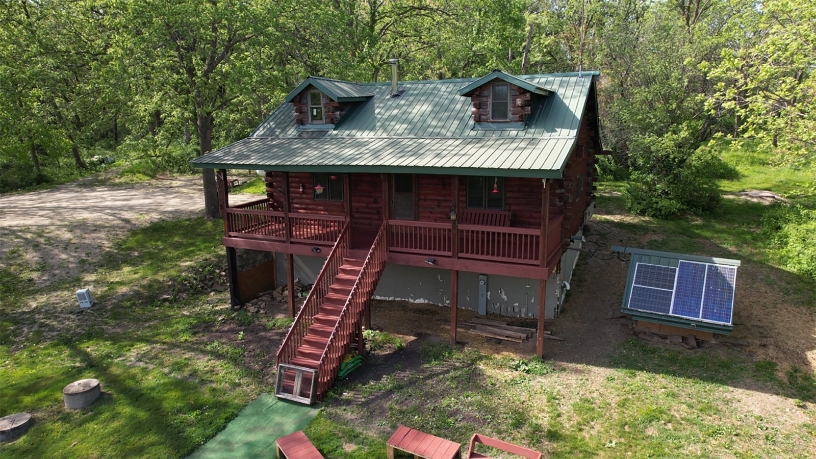 Find yourself surrounded by wooded acres sitting on the covered porch of this secluded log cabin located in central Grant County. There you can enjoy everything nature has to offer from excellent whitetail hunting to watching the variety of birds that frequent the feeders. The log cabin offers all the amenities of modern living including water, septic, electric and LP. The two centrally located food plots along with a spring-fed pond attract deer and other wildlife from the surrounding area. In the spring, enjoy chasing turkey and hunting for morel mushrooms. Take your UTV around the property or down the road just 0.2 miles away to Stitzer Bar & Grill. Perfect for any outdoor enthusiasts!<BR>
-LOG CABIN
-36+/- WOODED ACRES
-FOOD PLOTS
-EXCELLENT WHITETAIL AND TURKEY HUNTING
-POND - REAL ESTATE FOR SALE - 36+/- ACRES IN GRANT COUNTY WISCONSIN