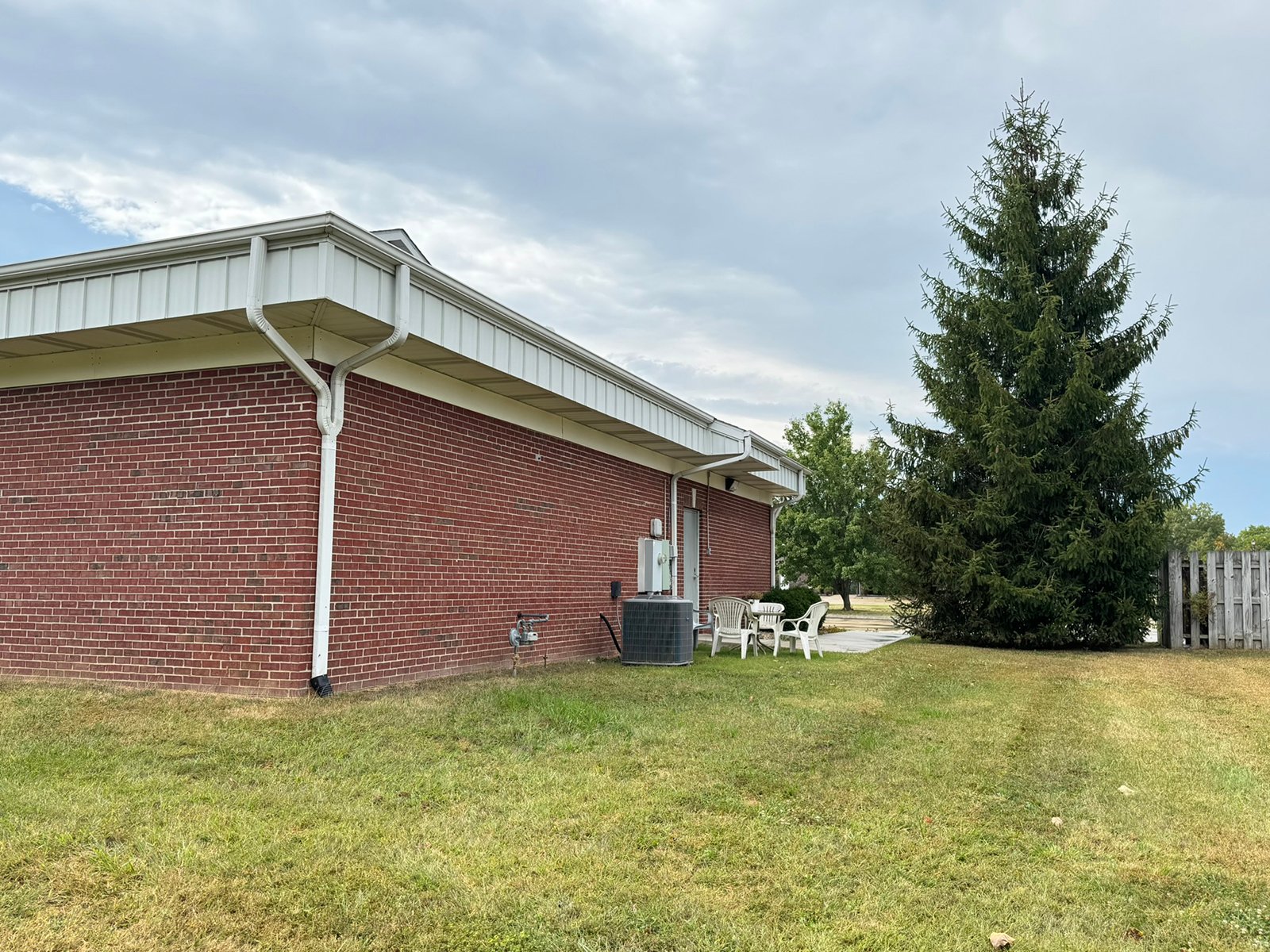 Outstanding opportunity to acquire a commercial property in Greencastle, IN with a proven long-term tenant. This site has been home to the Indiana Bureau of Motor Vehicles for more than 20 years under a favorable lease, ensuring minimal landlord responsibilities. With the current tenant there are no real estate taxes on the property.
The property spans 0.98+/- acres and includes a 4,947+/- sq ft building, built in 2004, along with a 15,180+/- sq ft parking lot providing ample customer convenience. The location is excellent - situated in Greencastle  Township, just East of Greencastle High School. With easy access from Veterans Memorial Highway (US-231) via Mill Pond Drive, the site benefits from both visibility and accessibility.
With a strong, creditworthy tenant and reliable cash flow, this property is an ideal choice for investors looking for secure, long-term income in a community-centered market. - COMMERCIAL REAL ESTATE FOR SALE - .98+/-ACRES IN PUTNAM COUNTY, INDIANA
