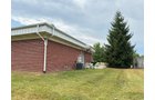 Outstanding opportunity to acquire a commercial property in Greencastle, IN with a proven long-term tenant. This site has been home to the Indiana Bureau of Motor Vehicles for more than 20 years under a favorable lease, ensuring minimal landlord responsibilities. With the current tenant there are no real estate taxes on the property.
The property spans 0.98+/- acres and includes a 4,947+/- sq ft building, built in 2004, along with a 15,180+/- sq ft parking lot providing ample customer convenience. The location is excellent - situated in Greencastle Township, just East of Greencastle High School. With easy access from Veterans Memorial Highway (US-231) via Mill Pond Drive, the site benefits from both visibility and accessibility.
With a strong, creditworthy tenant and reliable cash flow, this property is an ideal choice for investors looking for secure, long-term income in a community-centered market. - COMMERCIAL REAL ESTATE FOR SALE - .98+/-ACRES IN PUTNAM COUNTY, INDIANA