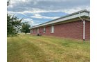 Outstanding opportunity to acquire a commercial property in Greencastle, IN with a proven long-term tenant. This site has been home to the Indiana Bureau of Motor Vehicles for more than 20 years under a favorable lease, ensuring minimal landlord responsibilities. With the current tenant there are no real estate taxes on the property.
The property spans 0.98+/- acres and includes a 4,947+/- sq ft building, built in 2004, along with a 15,180+/- sq ft parking lot providing ample customer convenience. The location is excellent - situated in Greencastle Township, just East of Greencastle High School. With easy access from Veterans Memorial Highway (US-231) via Mill Pond Drive, the site benefits from both visibility and accessibility.
With a strong, creditworthy tenant and reliable cash flow, this property is an ideal choice for investors looking for secure, long-term income in a community-centered market. - COMMERCIAL REAL ESTATE FOR SALE - .98+/-ACRES IN PUTNAM COUNTY, INDIANA