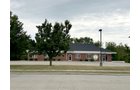 Outstanding opportunity to acquire a commercial property in Greencastle, IN with a proven long-term tenant. This site has been home to the Indiana Bureau of Motor Vehicles for more than 20 years under a favorable lease, ensuring minimal landlord responsibilities. With the current tenant there are no real estate taxes on the property.
The property spans 0.98+/- acres and includes a 4,947+/- sq ft building, built in 2004, along with a 15,180+/- sq ft parking lot providing ample customer convenience. The location is excellent - situated in Greencastle Township, just East of Greencastle High School. With easy access from Veterans Memorial Highway (US-231) via Mill Pond Drive, the site benefits from both visibility and accessibility.
With a strong, creditworthy tenant and reliable cash flow, this property is an ideal choice for investors looking for secure, long-term income in a community-centered market. - COMMERCIAL REAL ESTATE FOR SALE - .98+/-ACRES IN PUTNAM COUNTY, INDIANA