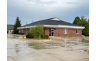 Outstanding opportunity to acquire a commercial property in Greencastle, IN with a proven long-term tenant. This site has been home to the Indiana Bureau of Motor Vehicles for more than 20 years under a favorable lease, ensuring minimal landlord responsibilities. With the current tenant there are no real estate taxes on the property.
The property spans 0.98+/- acres and includes a 4,947+/- sq ft building, built in 2004, along with a 15,180+/- sq ft parking lot providing ample customer convenience. The location is excellent - situated in Greencastle Township, just East of Greencastle High School. With easy access from Veterans Memorial Highway (US-231) via Mill Pond Drive, the site benefits from both visibility and accessibility.
With a strong, creditworthy tenant and reliable cash flow, this property is an ideal choice for investors looking for secure, long-term income in a community-centered market. - COMMERCIAL REAL ESTATE FOR SALE - .98+/-ACRES IN PUTNAM COUNTY, INDIANA