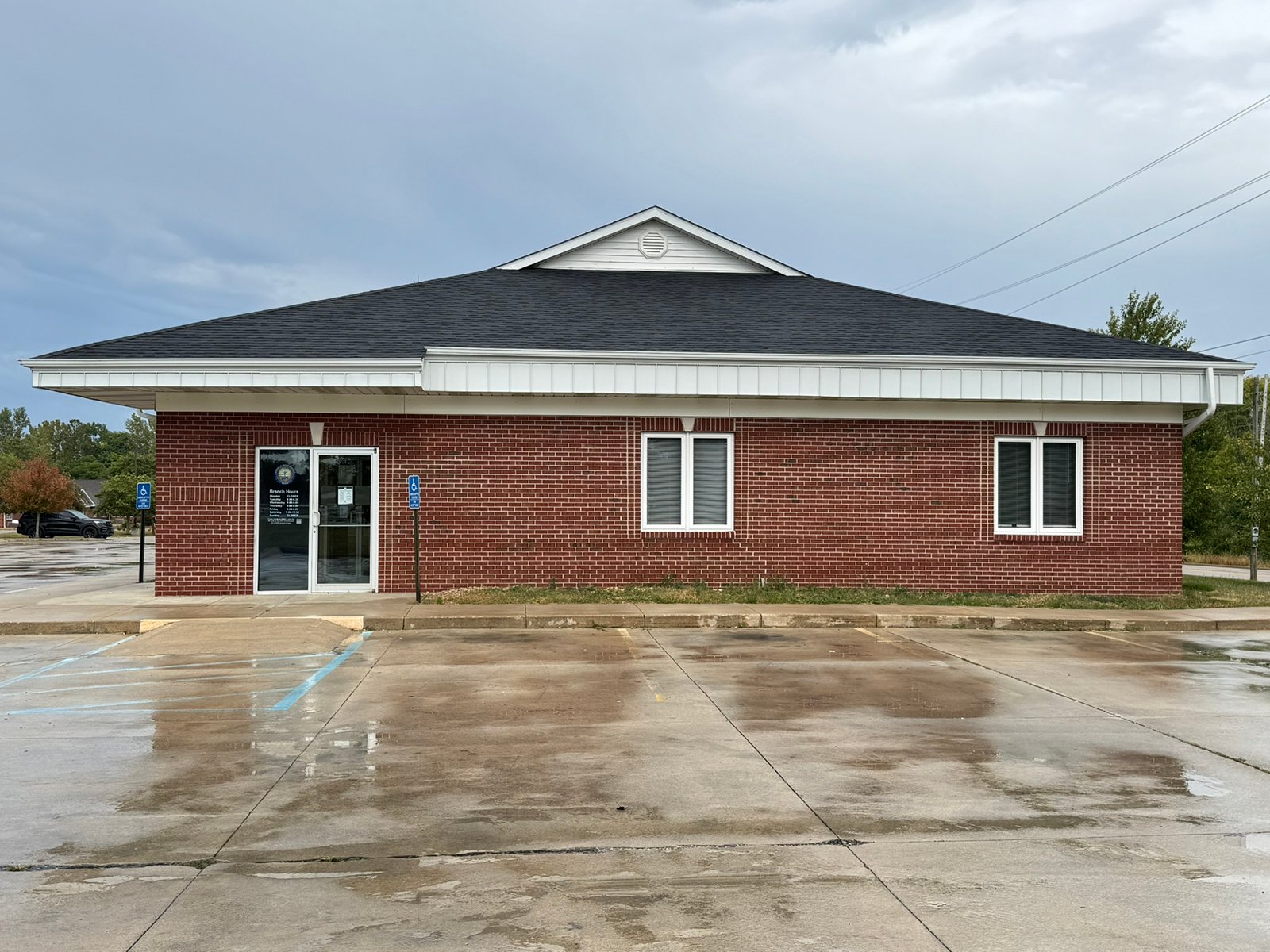 Outstanding opportunity to acquire a commercial property in Greencastle, IN with a proven long-term tenant. This site has been home to the Indiana Bureau of Motor Vehicles for more than 20 years under a favorable lease, ensuring minimal landlord responsibilities. With the current tenant there are no real estate taxes on the property.
The property spans 0.98+/- acres and includes a 4,947+/- sq ft building, built in 2004, along with a 15,180+/- sq ft parking lot providing ample customer convenience. The location is excellent - situated in Greencastle  Township, just East of Greencastle High School. With easy access from Veterans Memorial Highway (US-231) via Mill Pond Drive, the site benefits from both visibility and accessibility.
With a strong, creditworthy tenant and reliable cash flow, this property is an ideal choice for investors looking for secure, long-term income in a community-centered market. - COMMERCIAL REAL ESTATE FOR SALE - .98+/-ACRES IN PUTNAM COUNTY, INDIANA