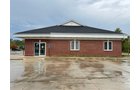 Outstanding opportunity to acquire a commercial property in Greencastle, IN with a proven long-term tenant. This site has been home to the Indiana Bureau of Motor Vehicles for more than 20 years under a favorable lease, ensuring minimal landlord responsibilities. With the current tenant there are no real estate taxes on the property.
The property spans 0.98+/- acres and includes a 4,947+/- sq ft building, built in 2004, along with a 15,180+/- sq ft parking lot providing ample customer convenience. The location is excellent - situated in Greencastle Township, just East of Greencastle High School. With easy access from Veterans Memorial Highway (US-231) via Mill Pond Drive, the site benefits from both visibility and accessibility.
With a strong, creditworthy tenant and reliable cash flow, this property is an ideal choice for investors looking for secure, long-term income in a community-centered market. - COMMERCIAL REAL ESTATE FOR SALE - .98+/-ACRES IN PUTNAM COUNTY, INDIANA