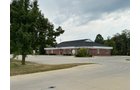 Outstanding opportunity to acquire a commercial property in Greencastle, IN with a proven long-term tenant. This site has been home to the Indiana Bureau of Motor Vehicles for more than 20 years under a favorable lease, ensuring minimal landlord responsibilities. With the current tenant there are no real estate taxes on the property.
The property spans 0.98+/- acres and includes a 4,947+/- sq ft building, built in 2004, along with a 15,180+/- sq ft parking lot providing ample customer convenience. The location is excellent - situated in Greencastle Township, just East of Greencastle High School. With easy access from Veterans Memorial Highway (US-231) via Mill Pond Drive, the site benefits from both visibility and accessibility.
With a strong, creditworthy tenant and reliable cash flow, this property is an ideal choice for investors looking for secure, long-term income in a community-centered market. - COMMERCIAL REAL ESTATE FOR SALE - .98+/-ACRES IN PUTNAM COUNTY, INDIANA