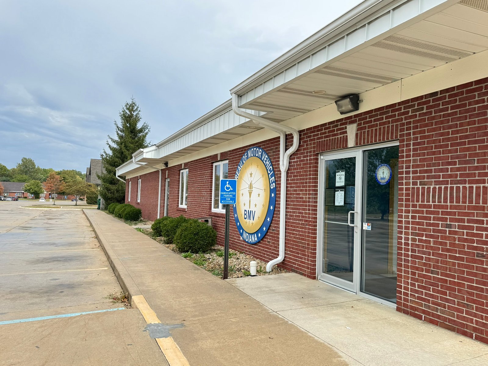Outstanding opportunity to acquire a commercial property in Greencastle, IN with a proven long-term tenant. This site has been home to the Indiana Bureau of Motor Vehicles for more than 20 years under a favorable lease, ensuring minimal landlord responsibilities. With the current tenant there are no real estate taxes on the property.
The property spans 0.98+/- acres and includes a 4,947+/- sq ft building, built in 2004, along with a 15,180+/- sq ft parking lot providing ample customer convenience. The location is excellent - situated in Greencastle  Township, just East of Greencastle High School. With easy access from Veterans Memorial Highway (US-231) via Mill Pond Drive, the site benefits from both visibility and accessibility.
With a strong, creditworthy tenant and reliable cash flow, this property is an ideal choice for investors looking for secure, long-term income in a community-centered market. - COMMERCIAL REAL ESTATE FOR SALE - .98+/-ACRES IN PUTNAM COUNTY, INDIANA