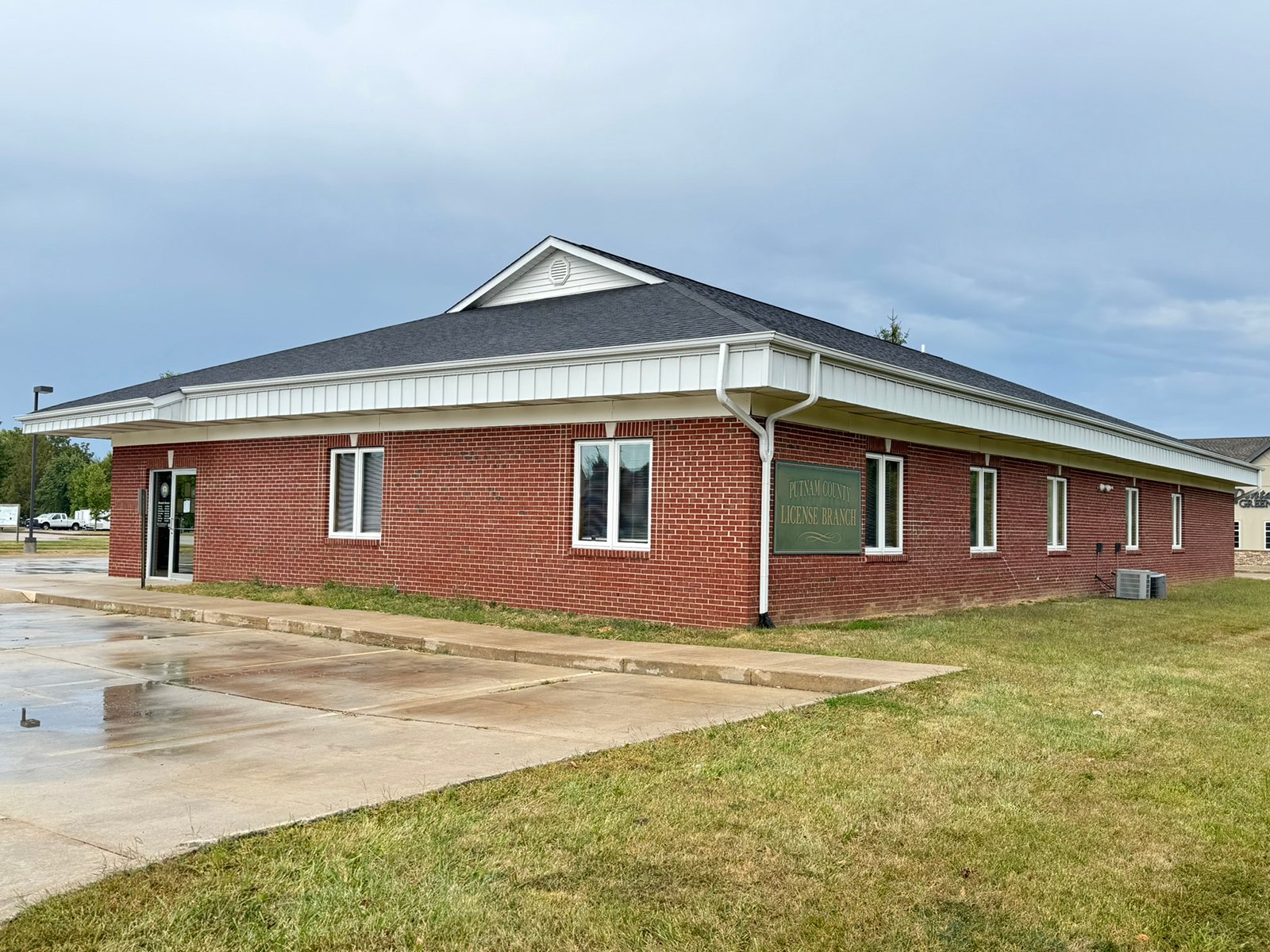 Outstanding opportunity to acquire a commercial property in Greencastle, IN with a proven long-term tenant. This site has been home to the Indiana Bureau of Motor Vehicles for more than 20 years under a favorable lease, ensuring minimal landlord responsibilities. With the current tenant there are no real estate taxes on the property.
The property spans 0.98+/- acres and includes a 4,947+/- sq ft building, built in 2004, along with a 15,180+/- sq ft parking lot providing ample customer convenience. The location is excellent - situated in Greencastle  Township, just East of Greencastle High School. With easy access from Veterans Memorial Highway (US-231) via Mill Pond Drive, the site benefits from both visibility and accessibility.
With a strong, creditworthy tenant and reliable cash flow, this property is an ideal choice for investors looking for secure, long-term income in a community-centered market. - COMMERCIAL REAL ESTATE FOR SALE - .98+/-ACRES IN PUTNAM COUNTY, INDIANA