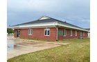 Outstanding opportunity to acquire a commercial property in Greencastle, IN with a proven long-term tenant. This site has been home to the Indiana Bureau of Motor Vehicles for more than 20 years under a favorable lease, ensuring minimal landlord responsibilities. With the current tenant there are no real estate taxes on the property.
The property spans 0.98+/- acres and includes a 4,947+/- sq ft building, built in 2004, along with a 15,180+/- sq ft parking lot providing ample customer convenience. The location is excellent - situated in Greencastle Township, just East of Greencastle High School. With easy access from Veterans Memorial Highway (US-231) via Mill Pond Drive, the site benefits from both visibility and accessibility.
With a strong, creditworthy tenant and reliable cash flow, this property is an ideal choice for investors looking for secure, long-term income in a community-centered market. - COMMERCIAL REAL ESTATE FOR SALE - .98+/-ACRES IN PUTNAM COUNTY, INDIANA