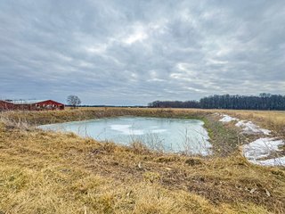 This is a tremendous opportunity to purchase a rural home and four Outbuildings with significant square footage under roof. The outbuildings offer a plethora of opportunities for livestock and/or storage, and the acreage allows for further expansion if desired. The outbuildings total 18,560 Sq. Ft. and the house contains 1,768 sq ft, 3 bedrooms, and one full bath. - REAL ESTATE FOR SALE 11.13+/- ACRES IN HUNTINGTON COUNTY, INDIANA